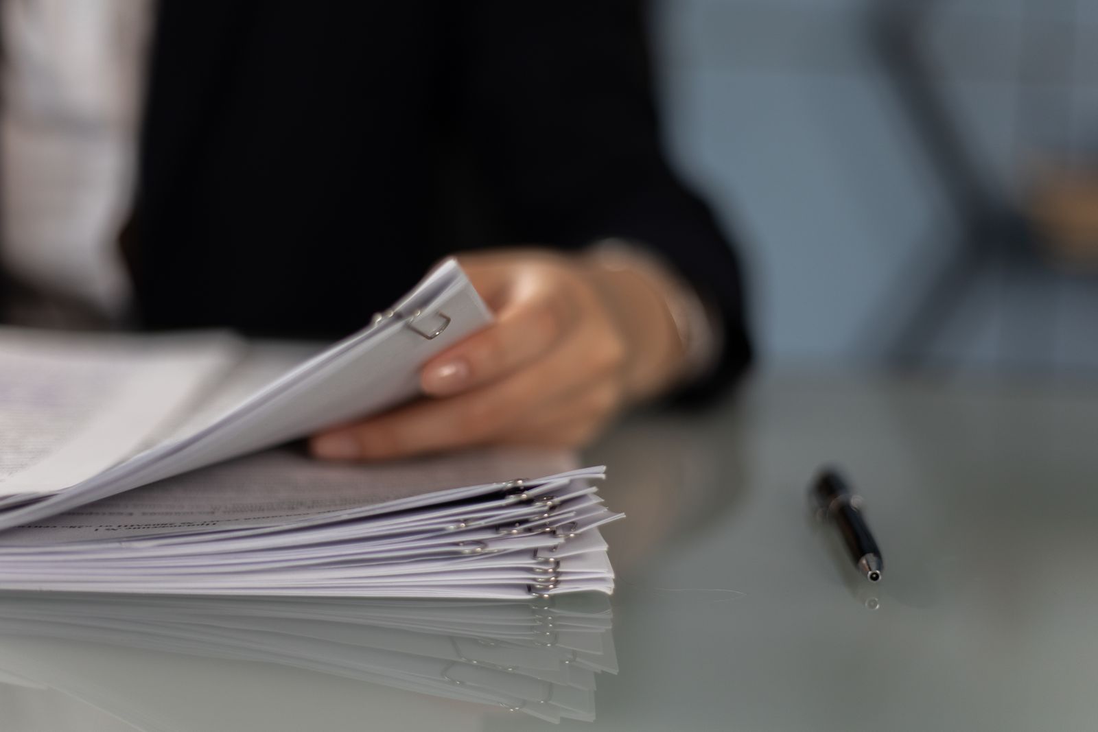 Close-up of resume and CV documents with a pen on a desk, comparing two application formats